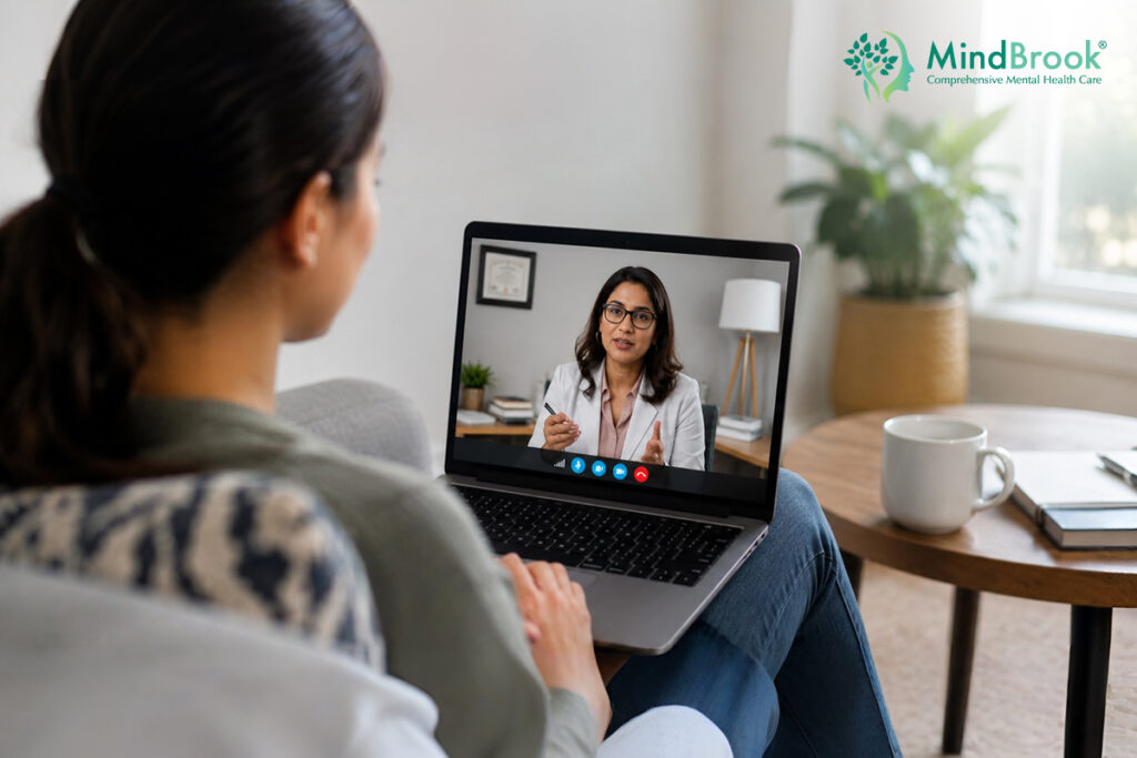 Patient attending a virtual telehealth psychiatry appointment on laptop from home — MindBrook Psychiatry, Tampa FL